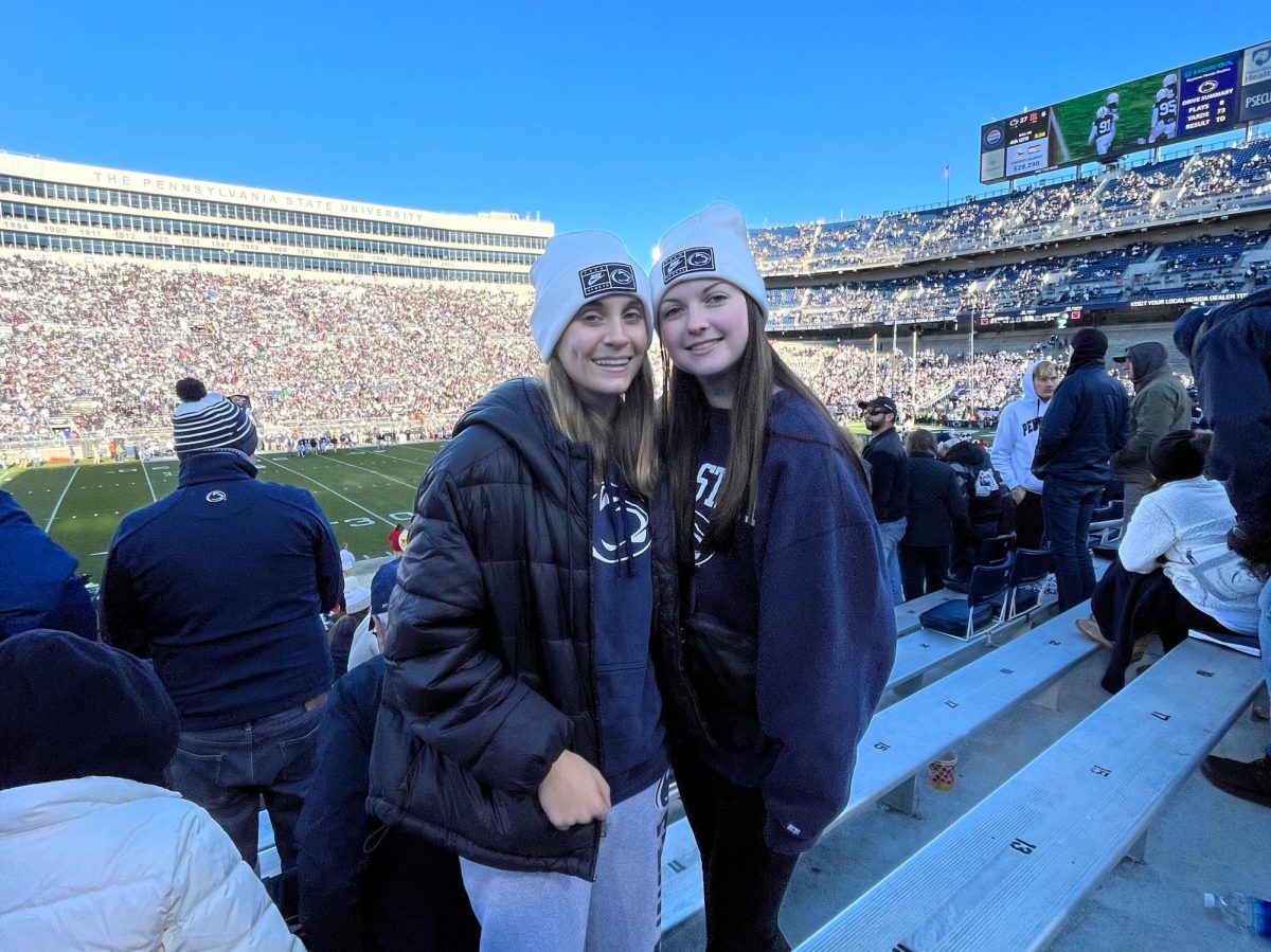 KNIGHTS VISIT LIONS - Two Knight Crier Editors, Peyton Stagliano (left) and Riley Roach (right), take on the State College Senior Day game.