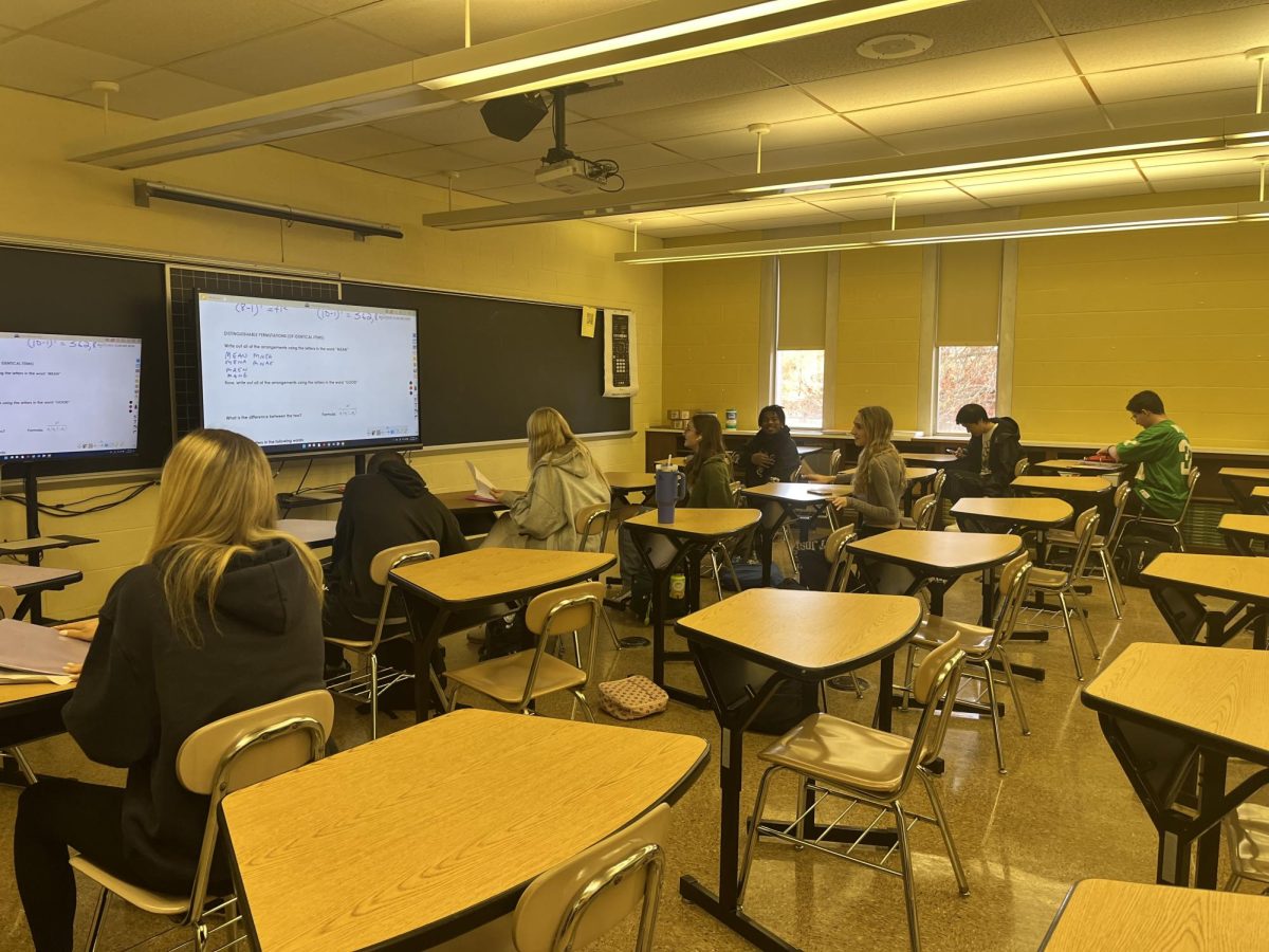 Mr Adam’s 5th period math class of 12 students taking notes. 
