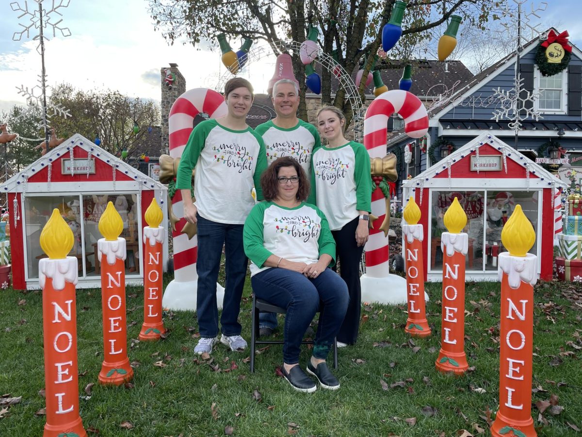 The Michael Family surrounded by some of their Christmas decorations before filming their segment on The Great Christmas Light Fight. 