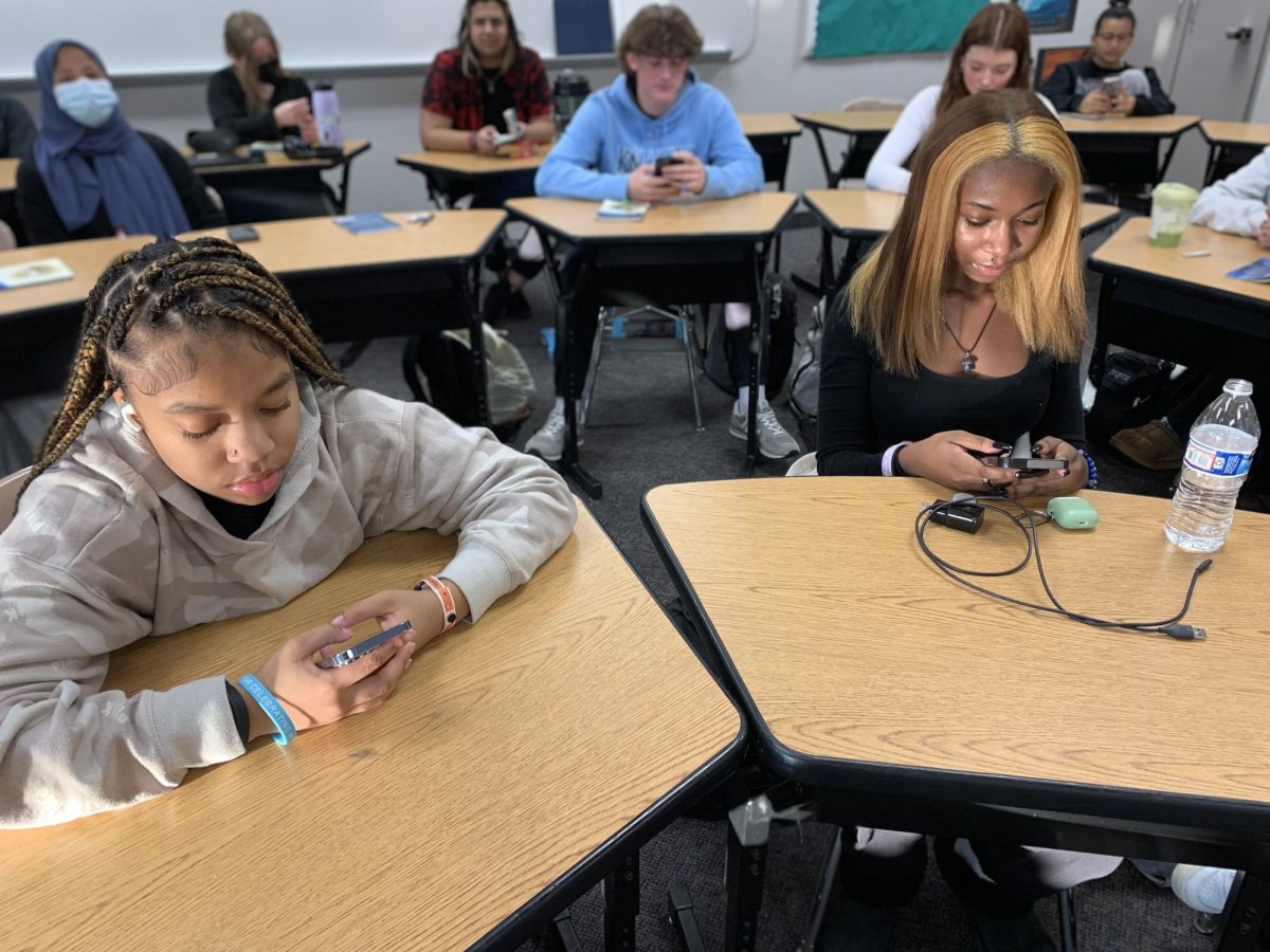 Its a Cell Phone World: Students at North Penn HS check their phones before class begins. 