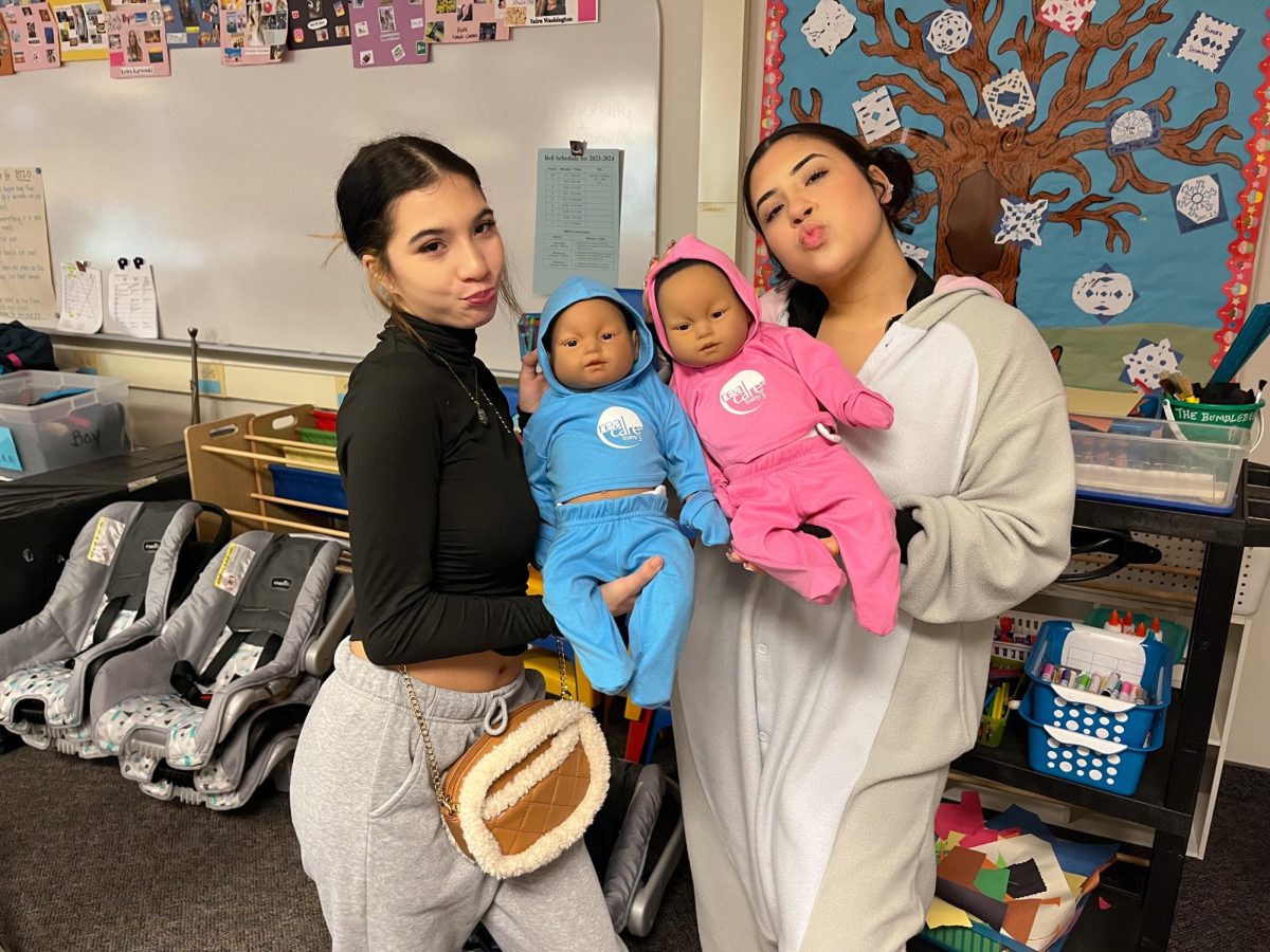 North Penn Child Development students holding their babies.