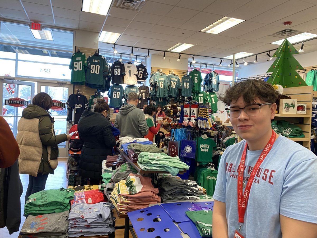 Sophomore Gabe Ramirez working through the hustle and bustle at Rally House, as customers purchase last-minute gifts for the holidays.
