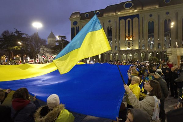 Ukrainians who live in Georgia and other demonstrators march with a giant Ukrainian flag in protest of Russias military aggression against Ukraine on the second anniversary of the war in Tbilisi, Georgia, Saturday, Feb. 24, 2024. (AP Photo/Shakh Aivazov)