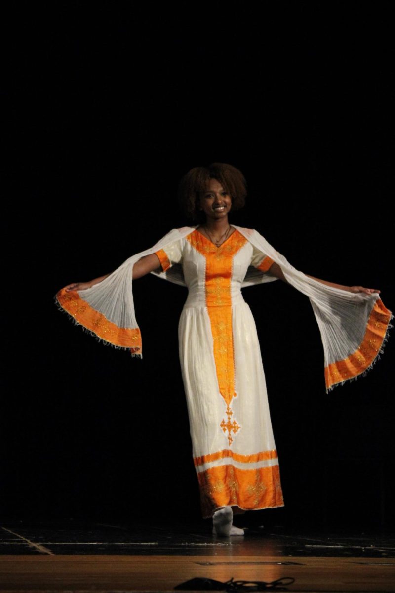 Yordanos Lemma showcases a traditional East African dress, a Kemis.
