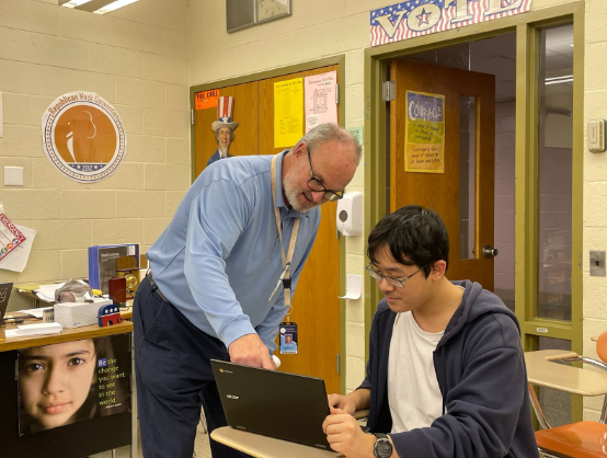 Government teacher Mr. Brian Haley, assisting one of his AP U.S. government students.