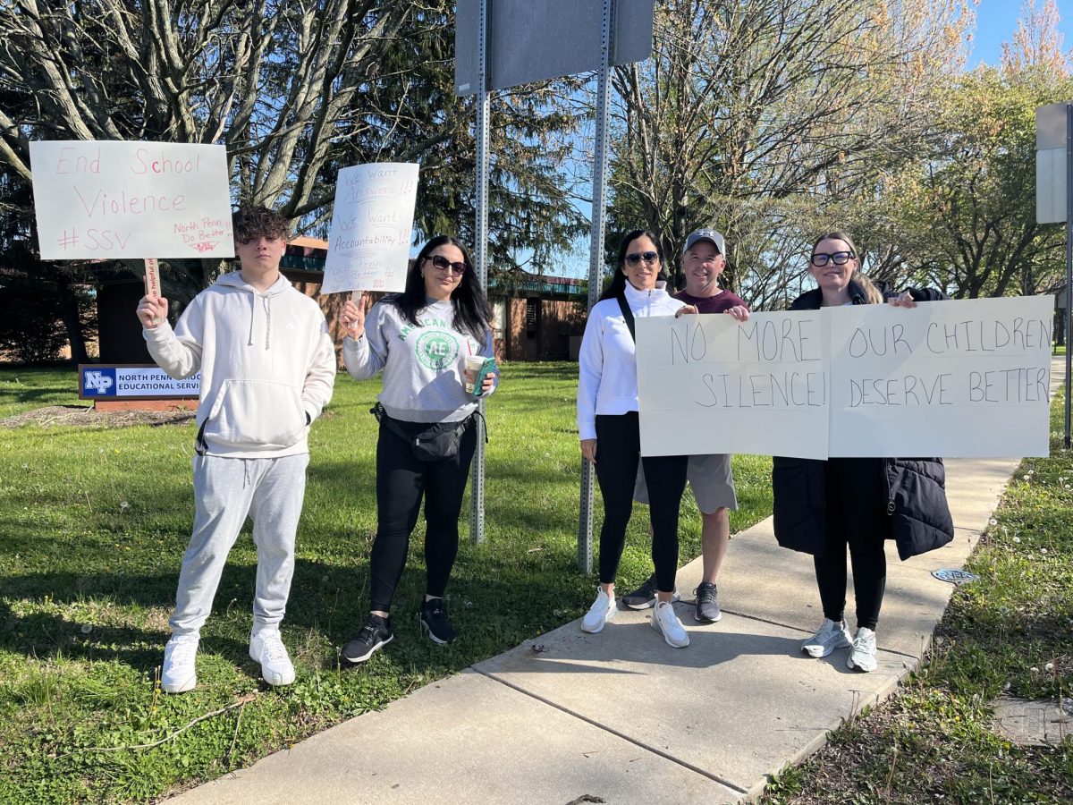 NPSD residents gather outside of the North Penn Educational Services Center on Tuesday, April 23, 2024. People assembled peacefully to express their concern over a recent assault at Pennbrook Middle School. 
