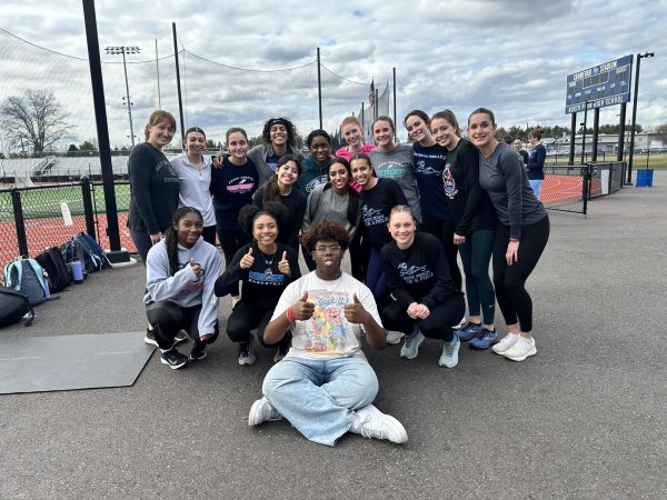 THE MANAGER AND THE TRACKSTARS. Seen above is Avery Brown, the North Penn Girls track teams new manager.
