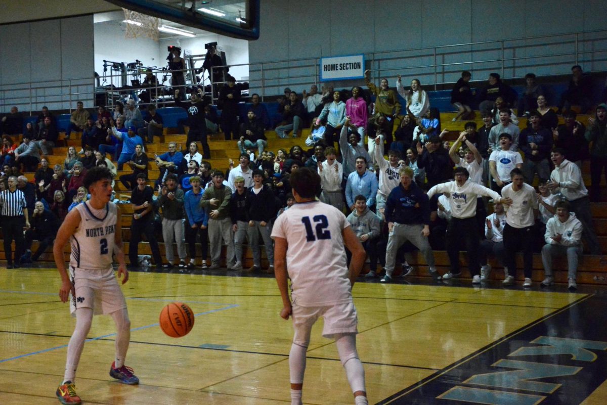 Brycen Foust celebrates with the home crowd after a steal and score to give the Knights the momentum.