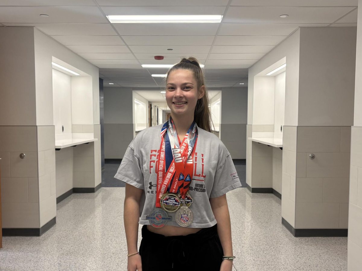 Weiloch sporting some of her medals: 3 International Cup, and 2 Junior Olympics.