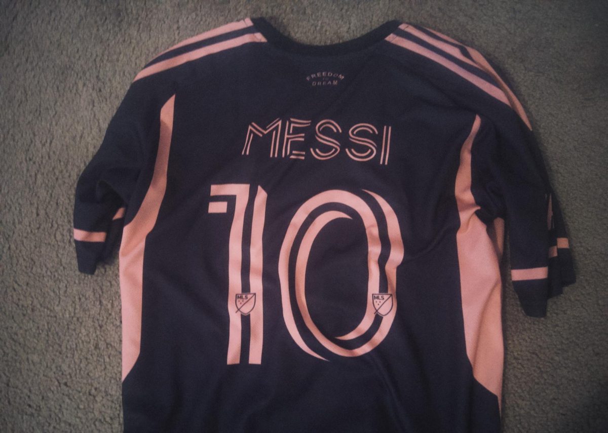 "Pink on my back, history in his hands."