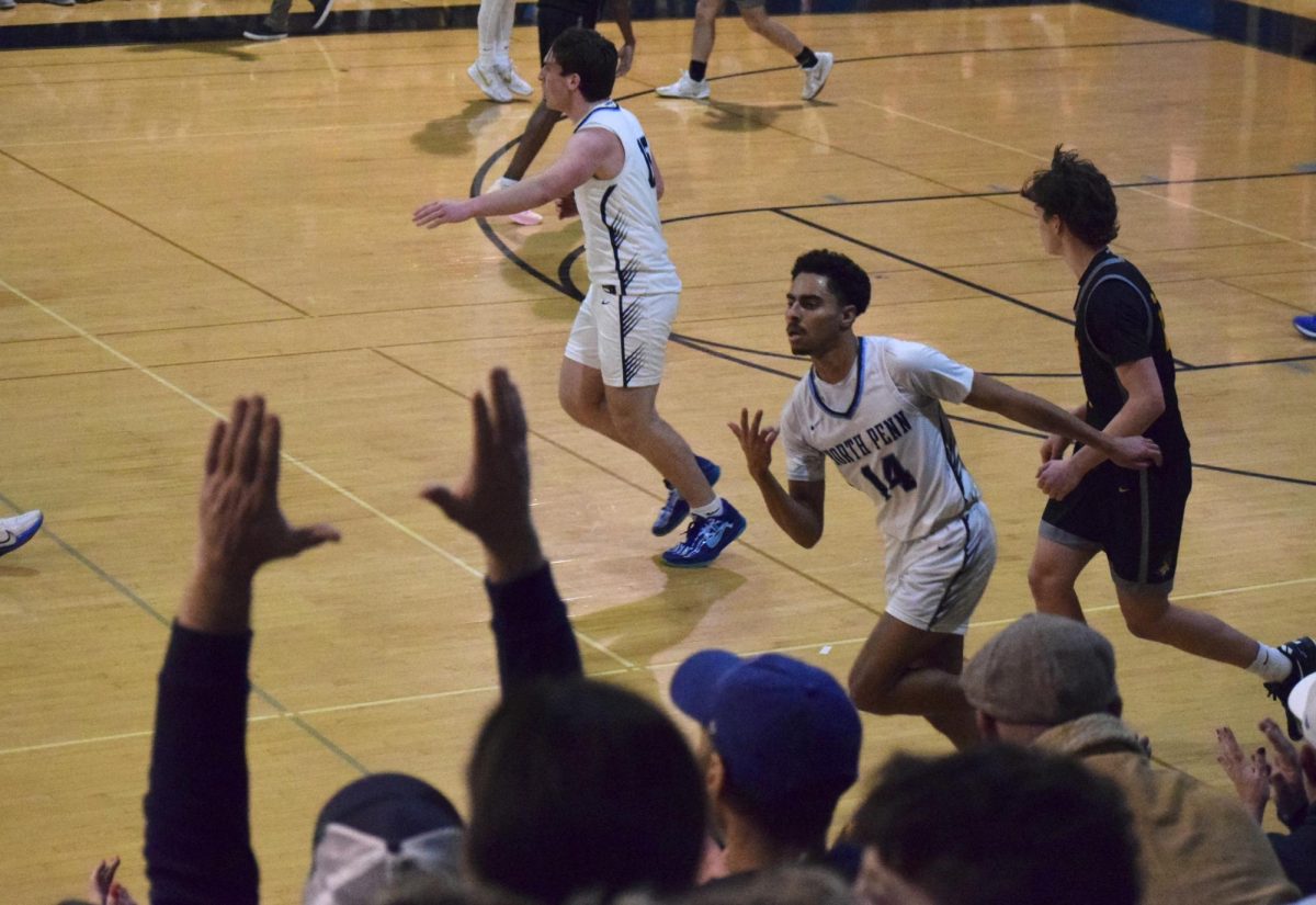 JC Wood celebrates after an onslaught of three's in the first quarter.