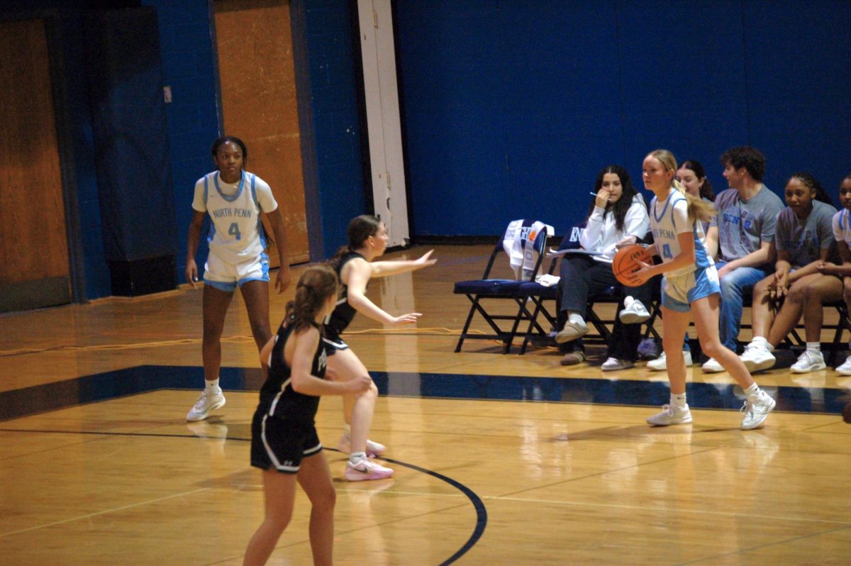 Senior Cailin Halfpenny observes the court during Thursday's senior night win.