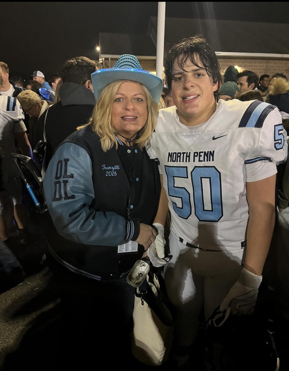 BOOSTING UP THE TEAM: Patty Tranzilli with her son, Dom, during the 2025 North Penn football season. 