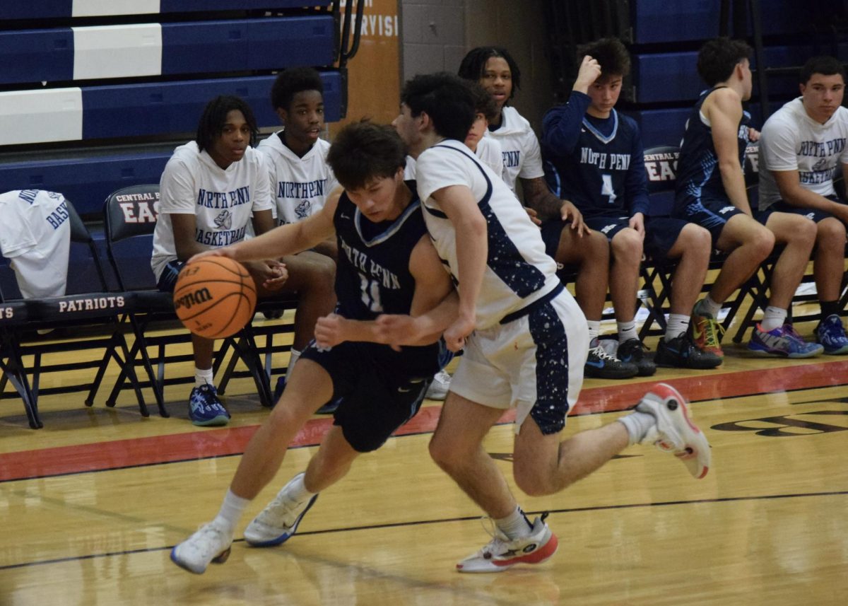 North Penn senior Nolen Foust drives to the baseline againt Central Bucks East on Tuesday.