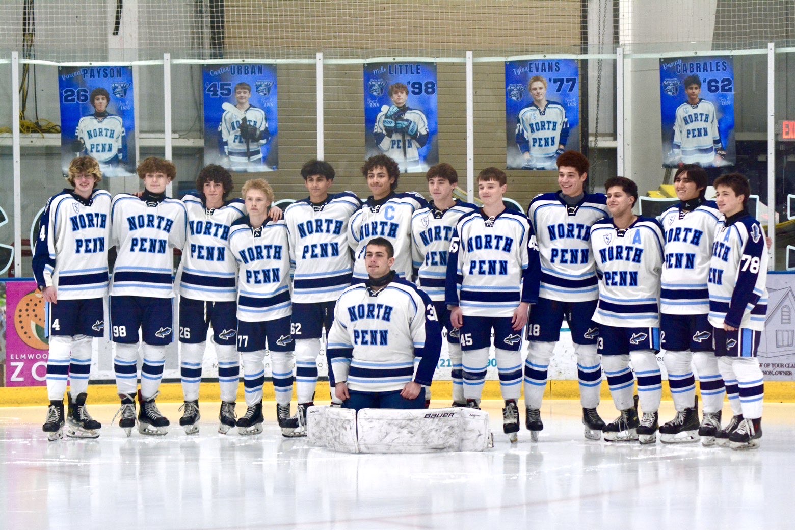 Knights seniors pose for picture during senior ceremony before game.