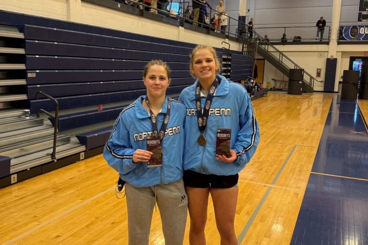 Senior Ella Maxwell and junior Godie Hart pose with Hershey bars following their successful Regional appearances.