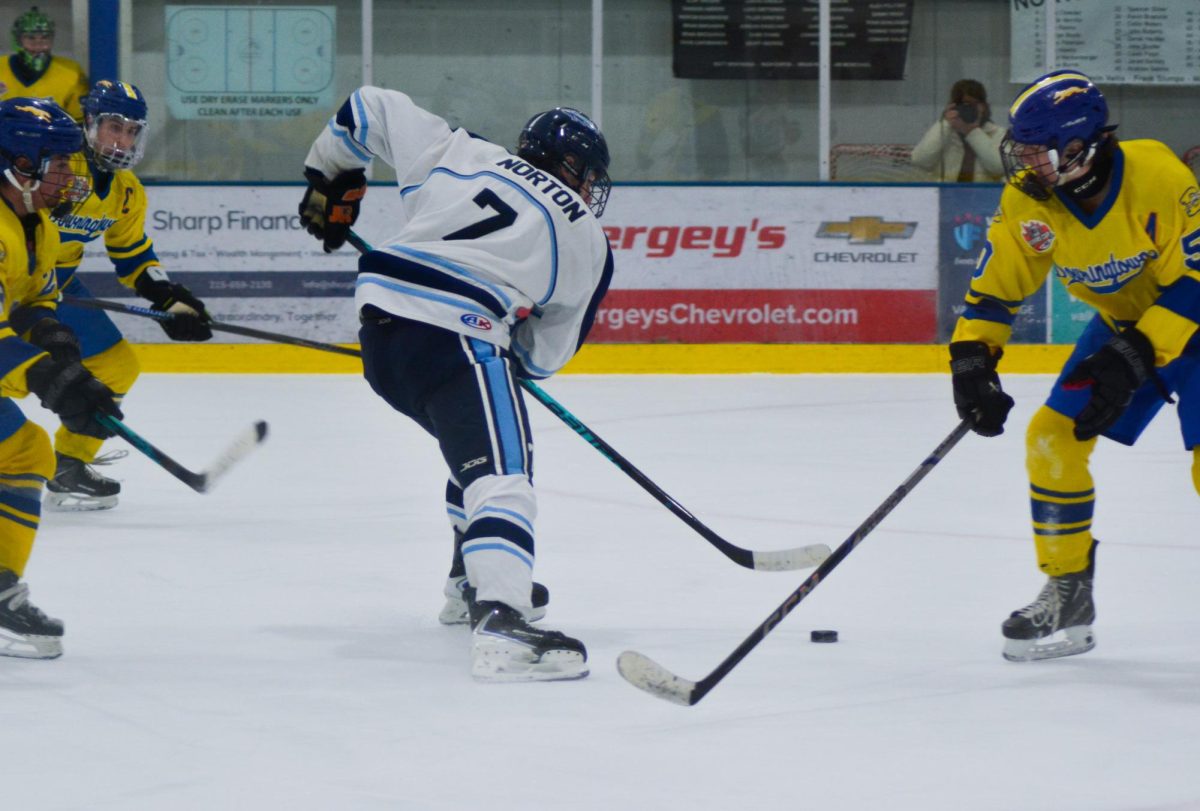 Sam Norton splits the Whippets defense with a swift move.