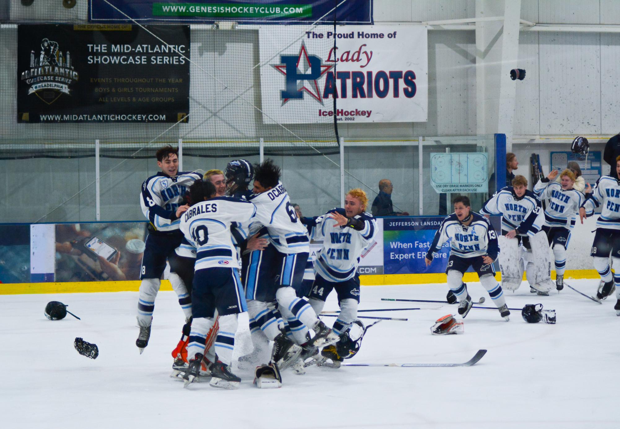 Knights celebrate after winning back to back Flyers Cup championships.